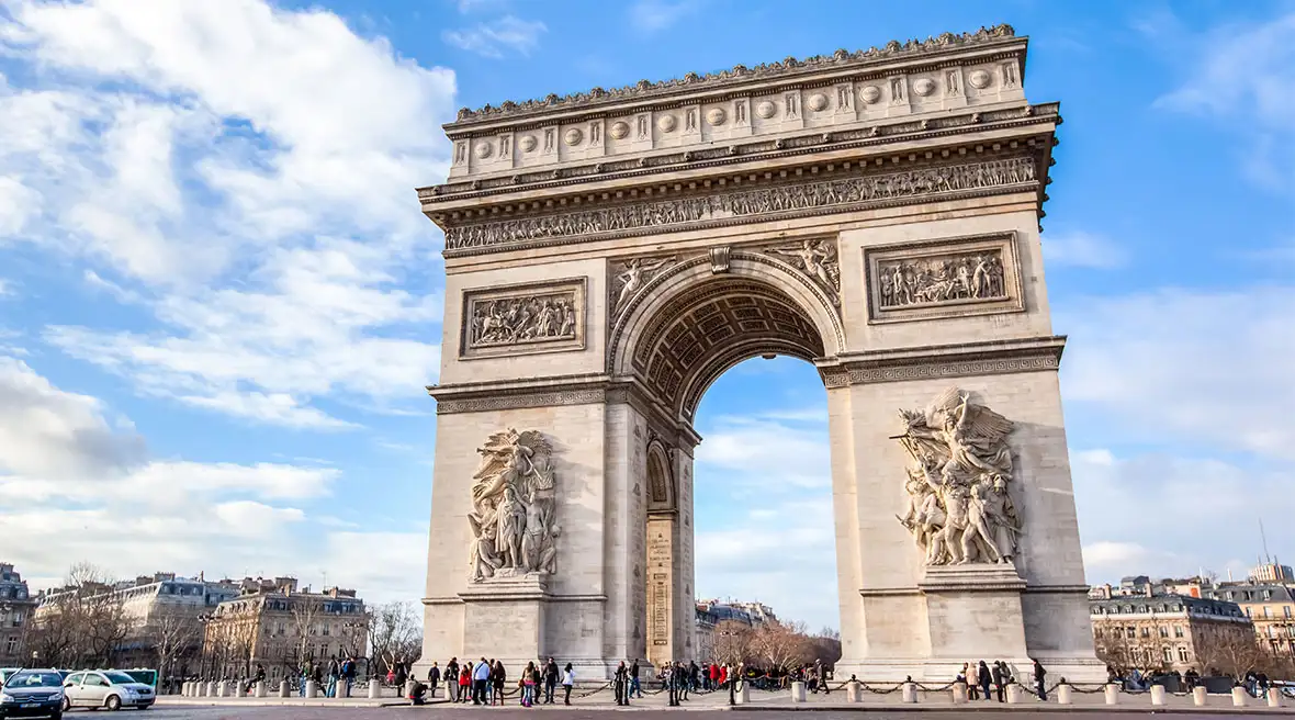 People standing and admiring the Arc de Triomphe