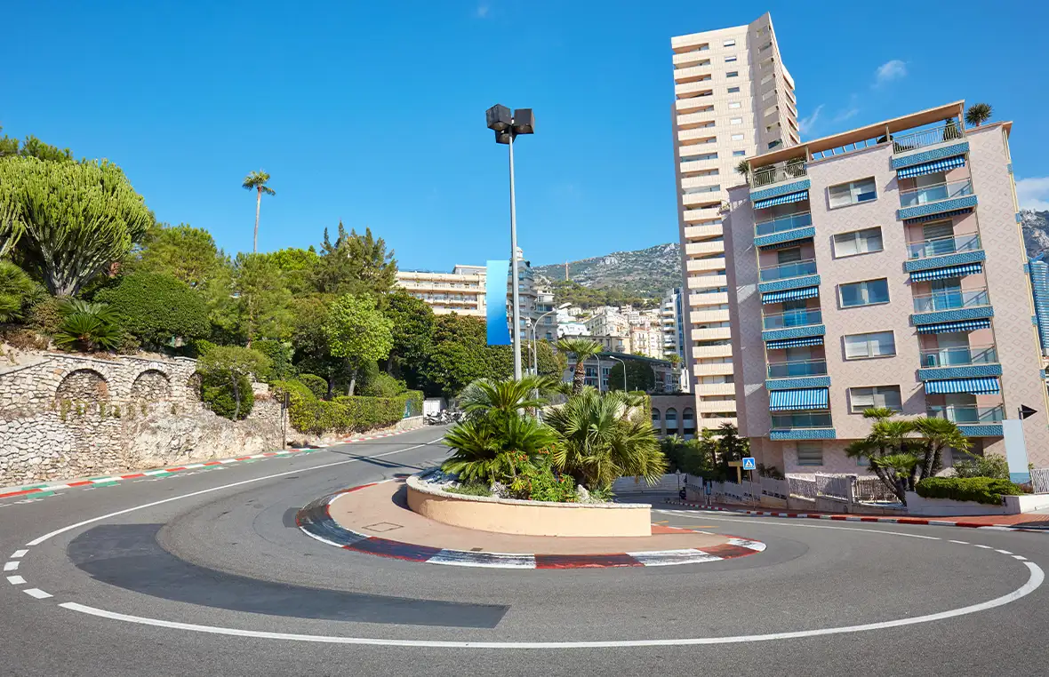 Monte Carlo street curve with formula one red and white sign on a sunny summers day in Monte Carlo, Monaco