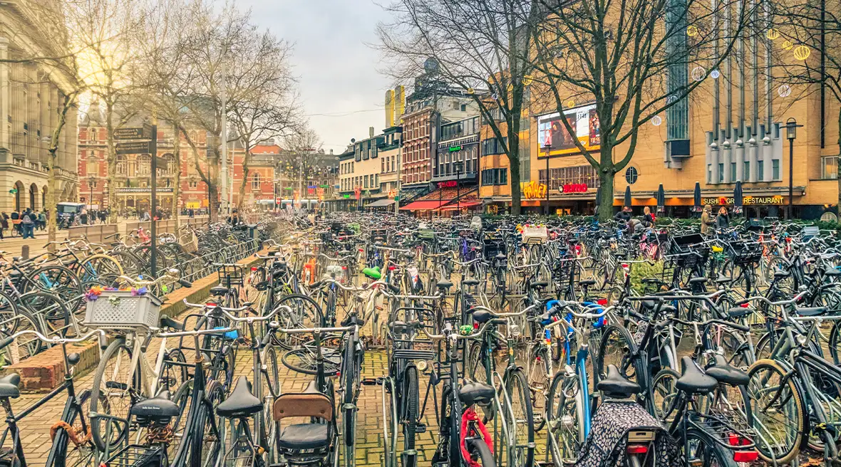 Cityscape on a sunny winter day - view of the bike parking in the historic center of Amsterdam, The Netherlands