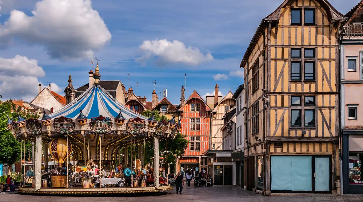 Half-timbered houses and a fairground ride