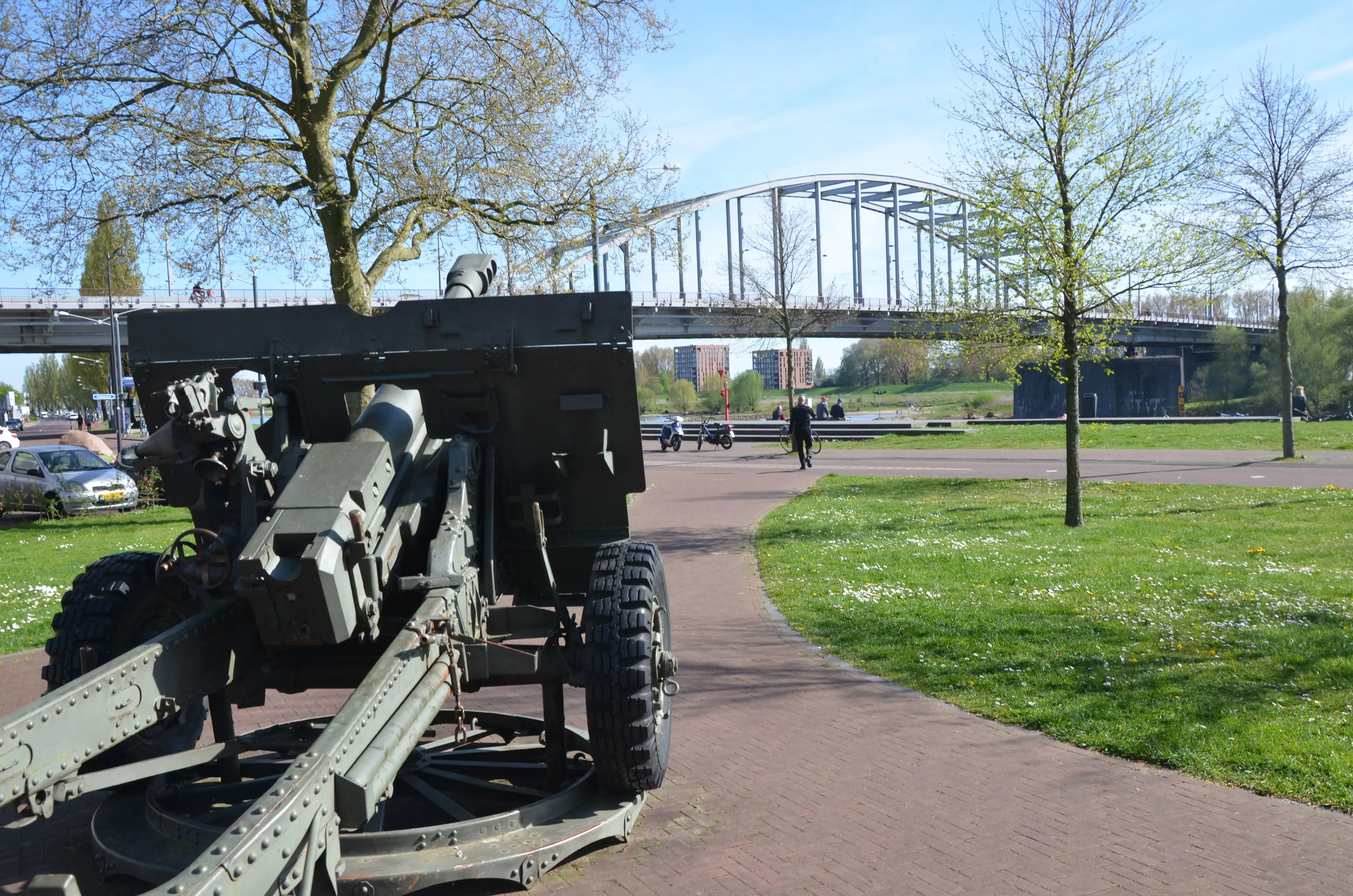 The John Frost Bridge at Arnhem with a WWII military gun in the foreground