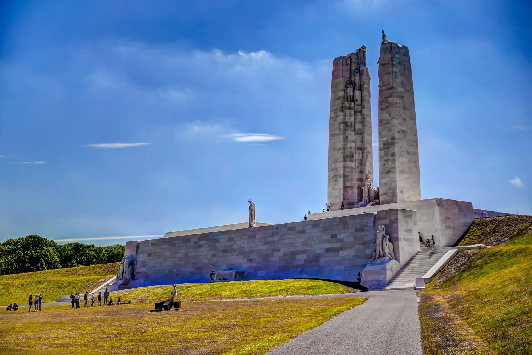 People visiting a large war memorial