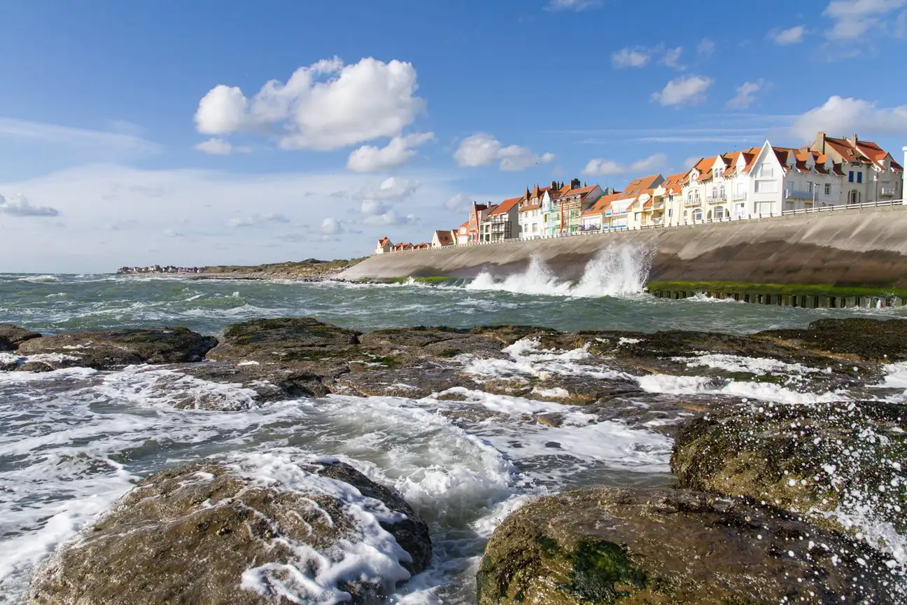 Ambleteuse seafront, with waves crashing on the sea wall