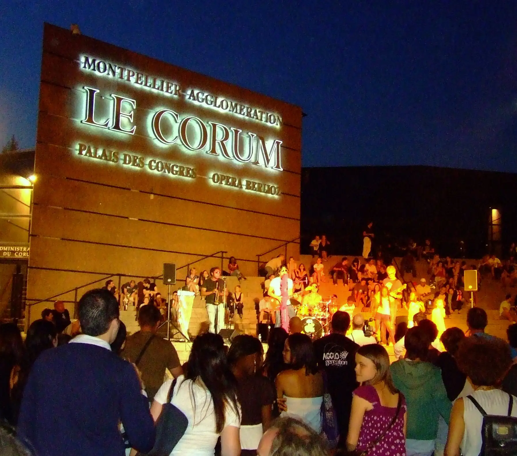A band playing on the steps of a venue in Montpellier