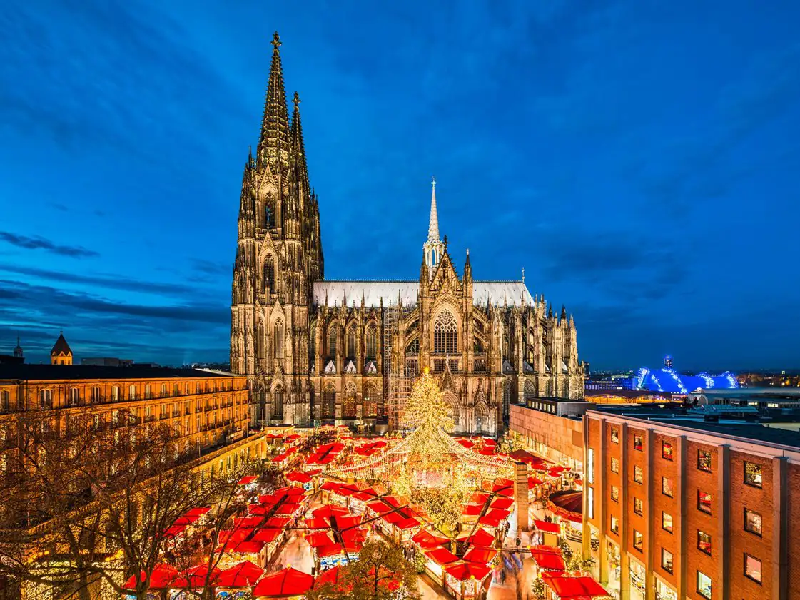 Christmas market stalls at Cologne cathedral at night