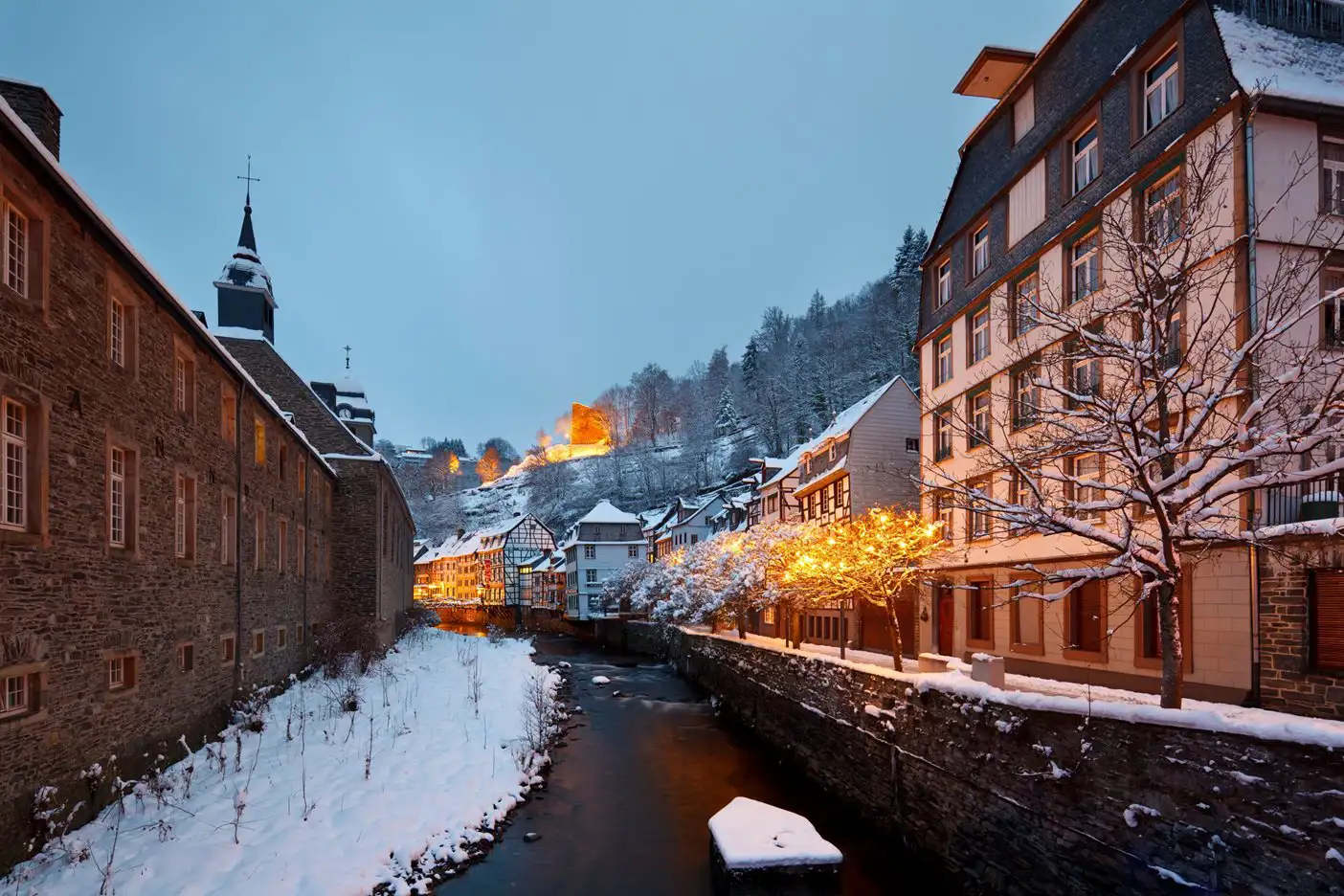 Snow laying on buildings and ground in Monschau, Germany