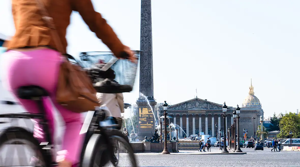 A view of the Luxor obelisk in Place de la Concorde in Paris alongside a large road busy with cars