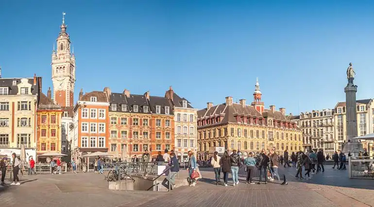 Market square in town centre with stalls and monument