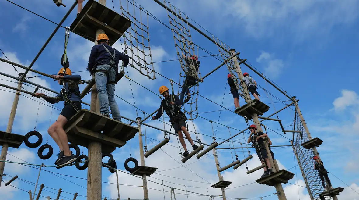 People climbing the aerial assault course at the Outside Adventure Park.
