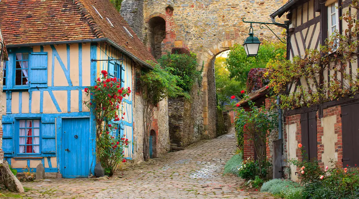 Cobbled streets, timbered house and brick archway in the picturesque French village of Gerberoy
