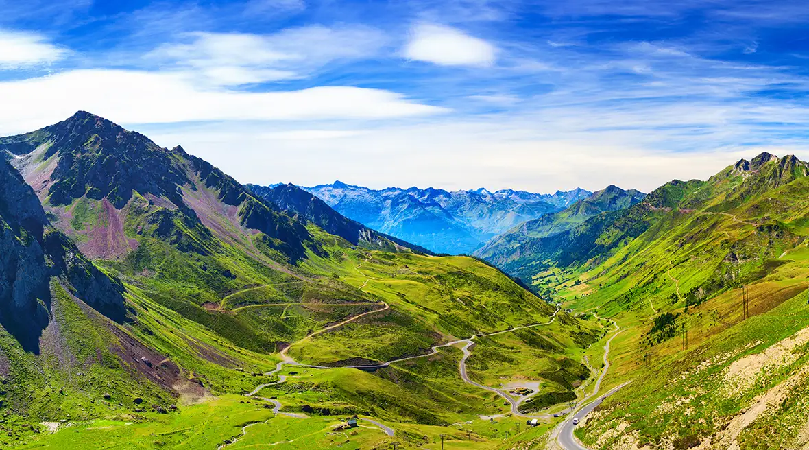 Lush green valley and mountains in sunshine