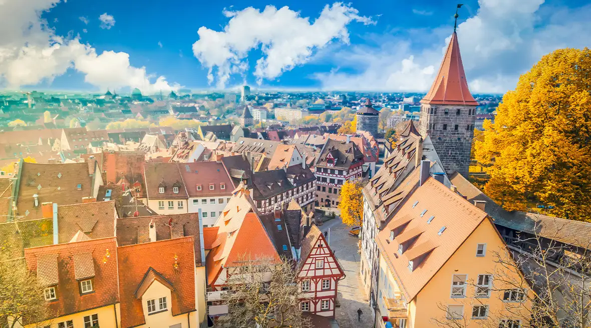 A panoramic view of Nuremberg Castle (Nürnberger Burg) and the surrounding historical center of Nuremberg, Germany against a sunny sky