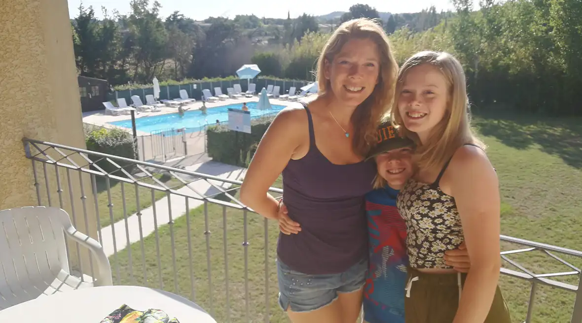 The family in their hotel in Avignon, with a pool in the background