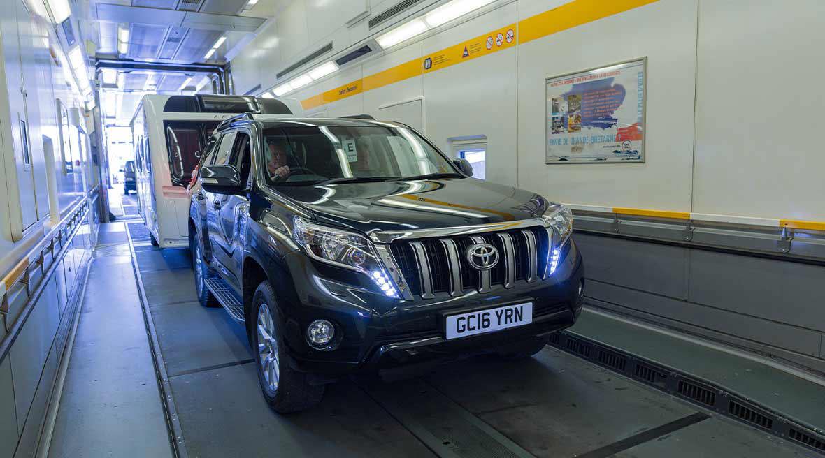 black car inside Eurotunnel Le Shuttle train