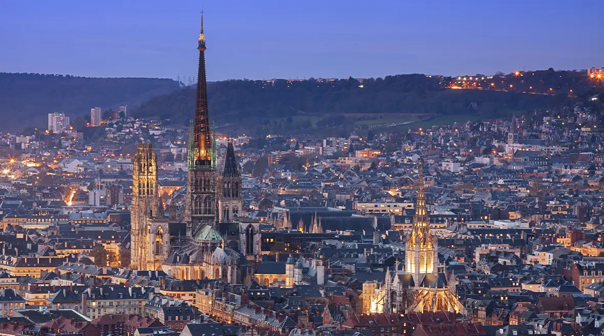 city skyline at night lit up with lights