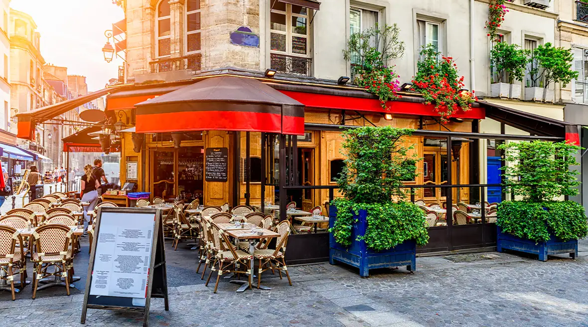 A cafe on a pretty street corner with seating
