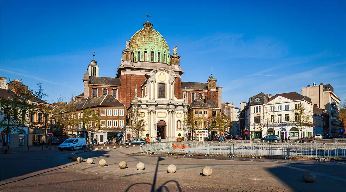 A church or cathedral and other buildings around a city square