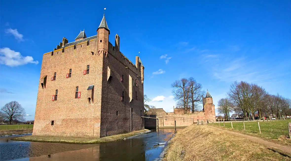 A square castle bailey with a moat around it