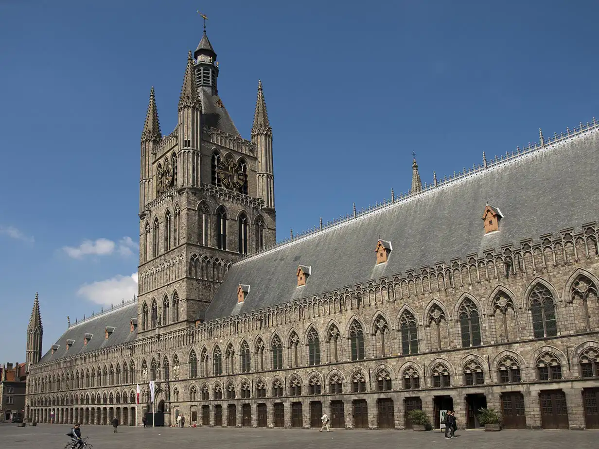 Long ornate religious-style building with square belfry