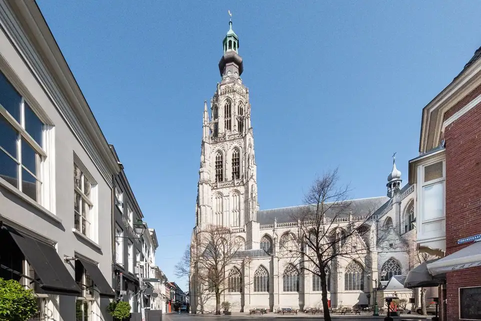 White gothic style church with very tall tower, Breda, Netherlands