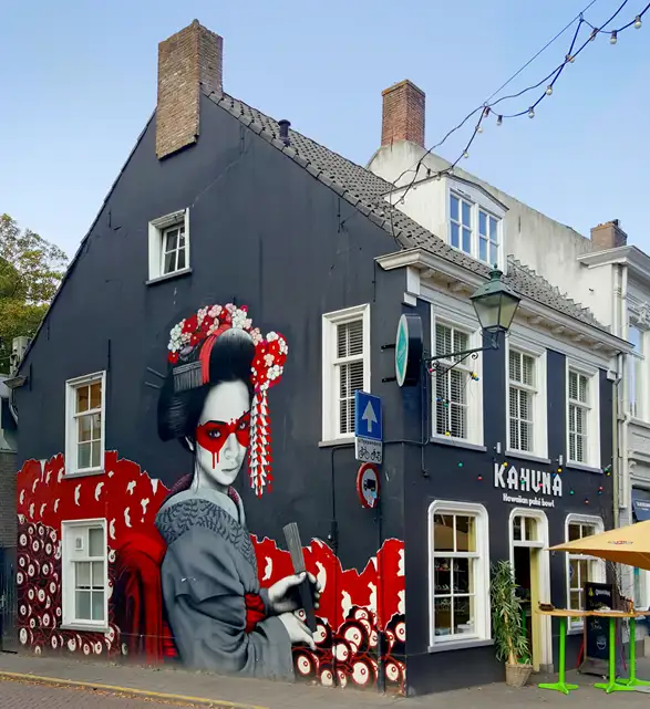 An oriental mural on the side of a building