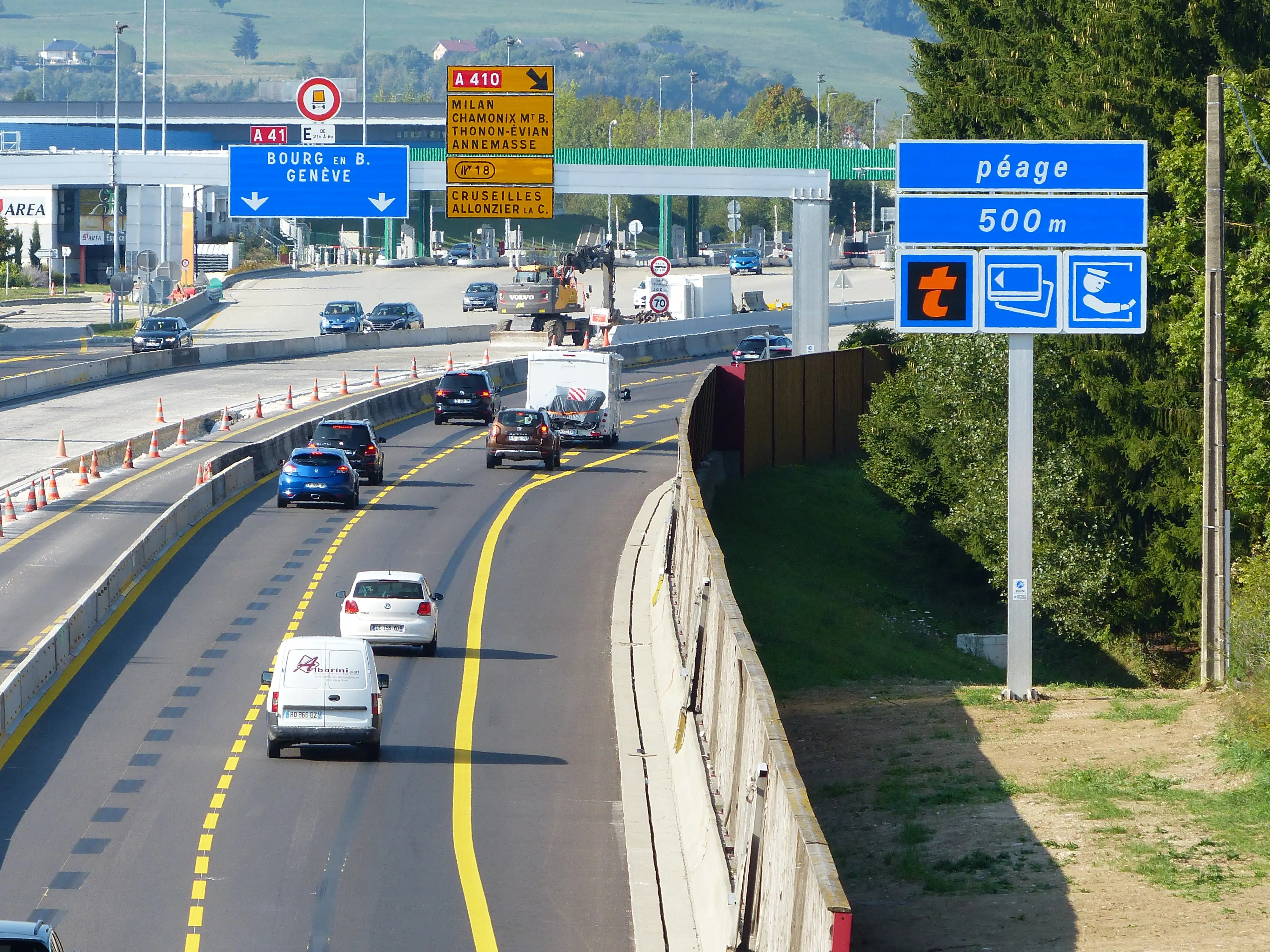 A motorway in France with free flowing traffic and overhead signs