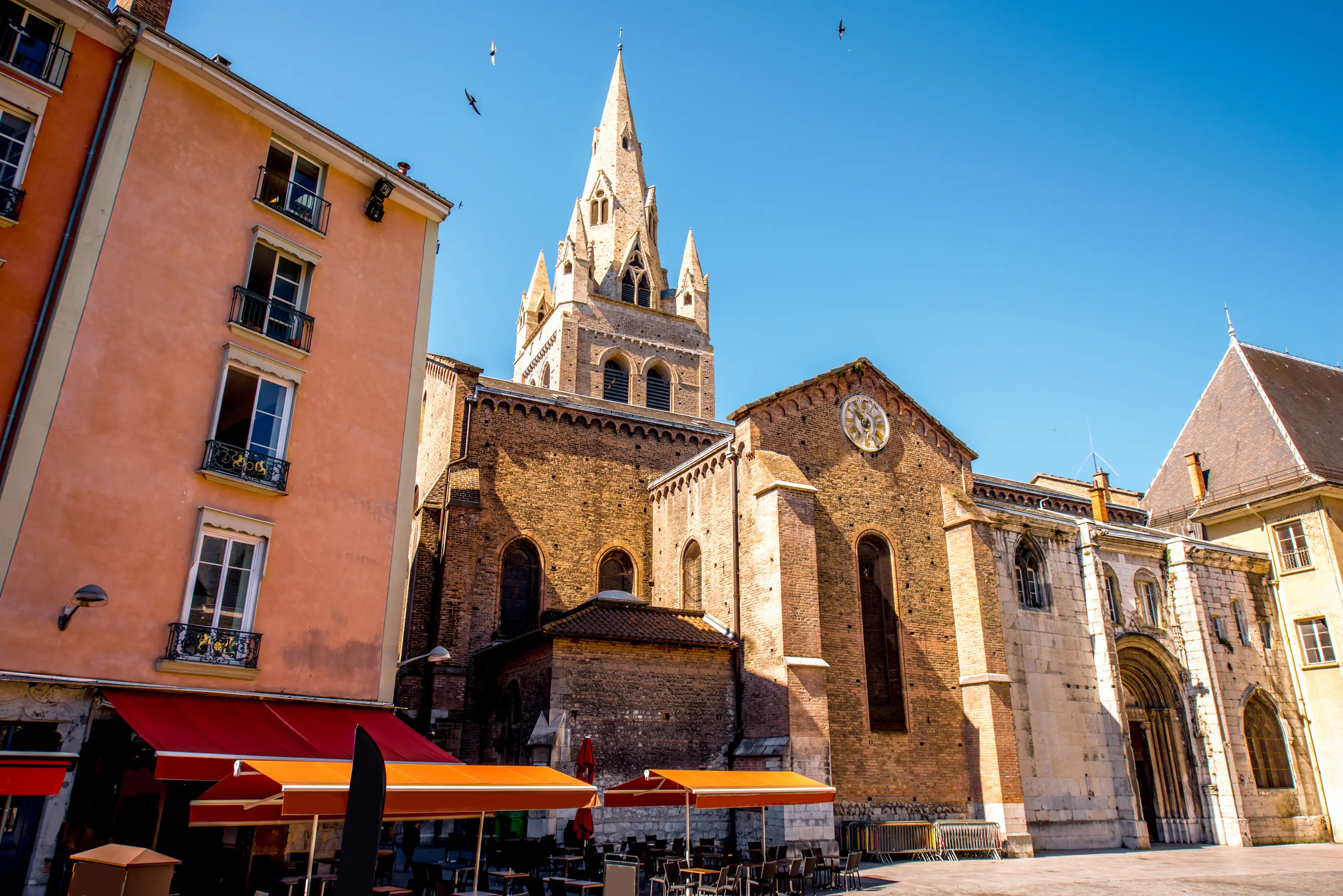 Saint Andrew church and Café de la Table Ronde, old town of Grenoble, France.