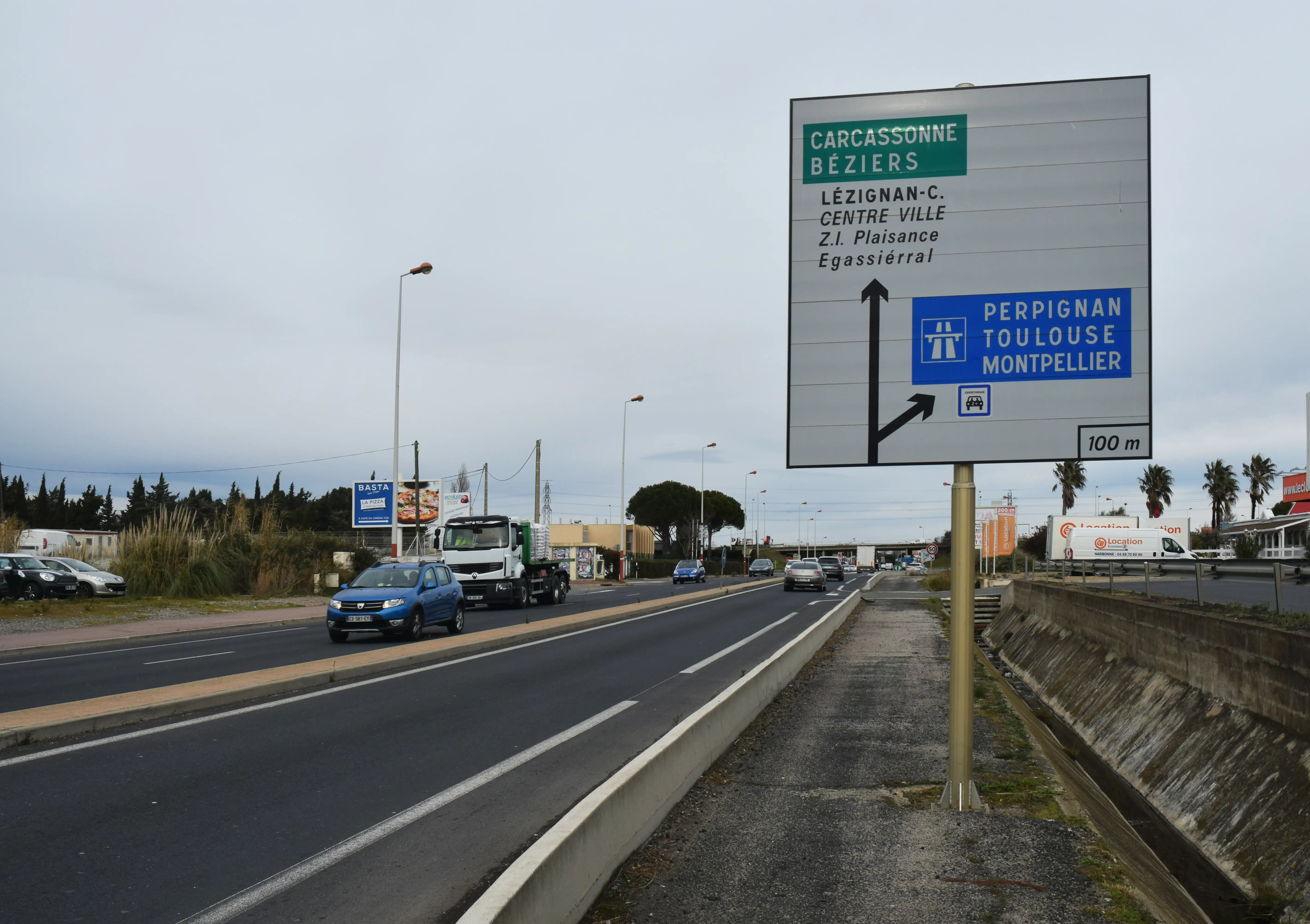Road sign in France, giving directions to Carcassonne, Beziers, Perpignan, Toulouse and Montpellier