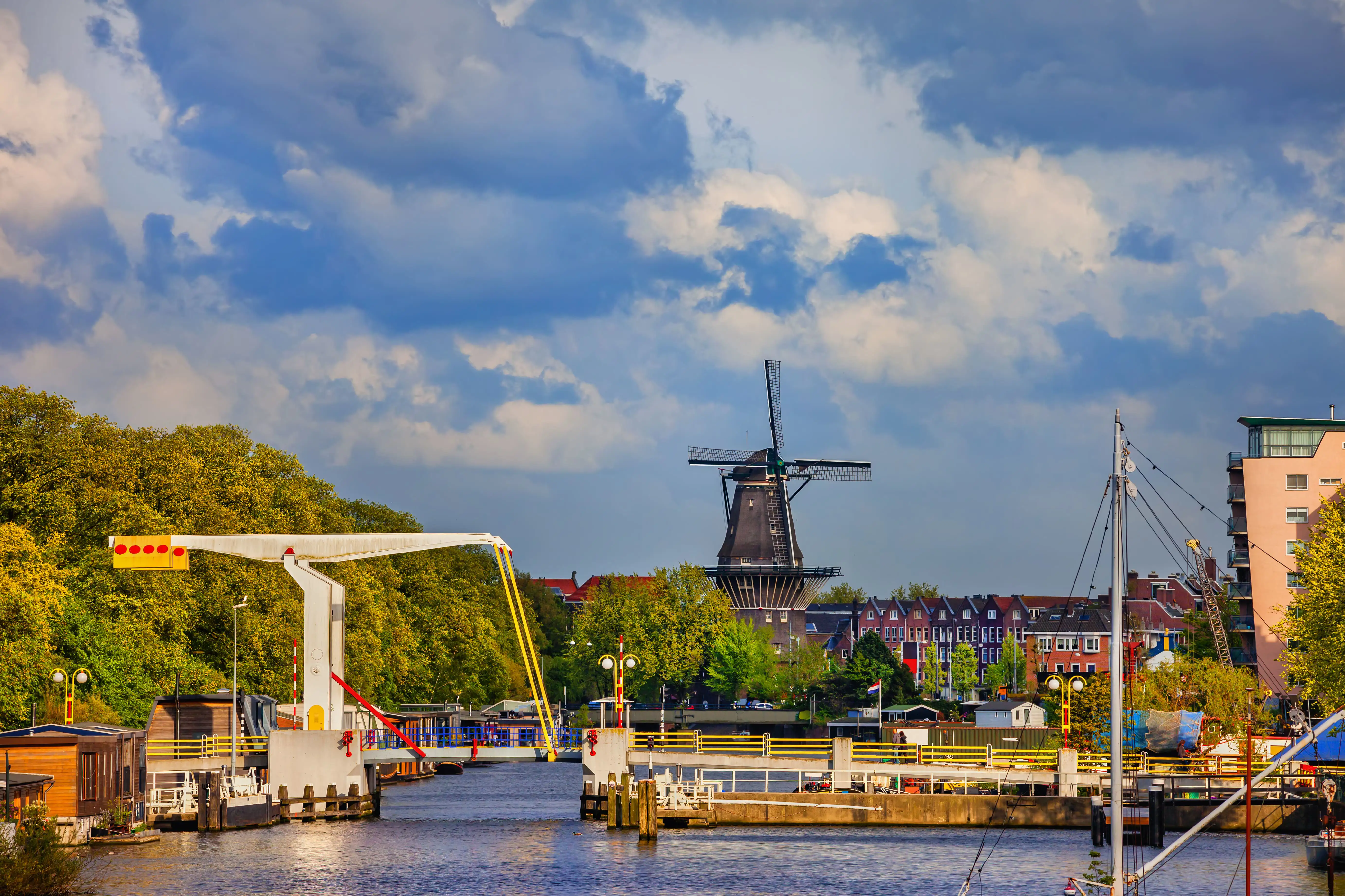 City Skyline With Drawbridge And Windmill, Amsterdam, Netherlands